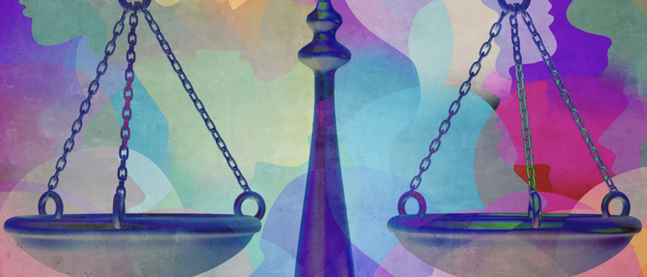 Scales of justice with multicolored face background